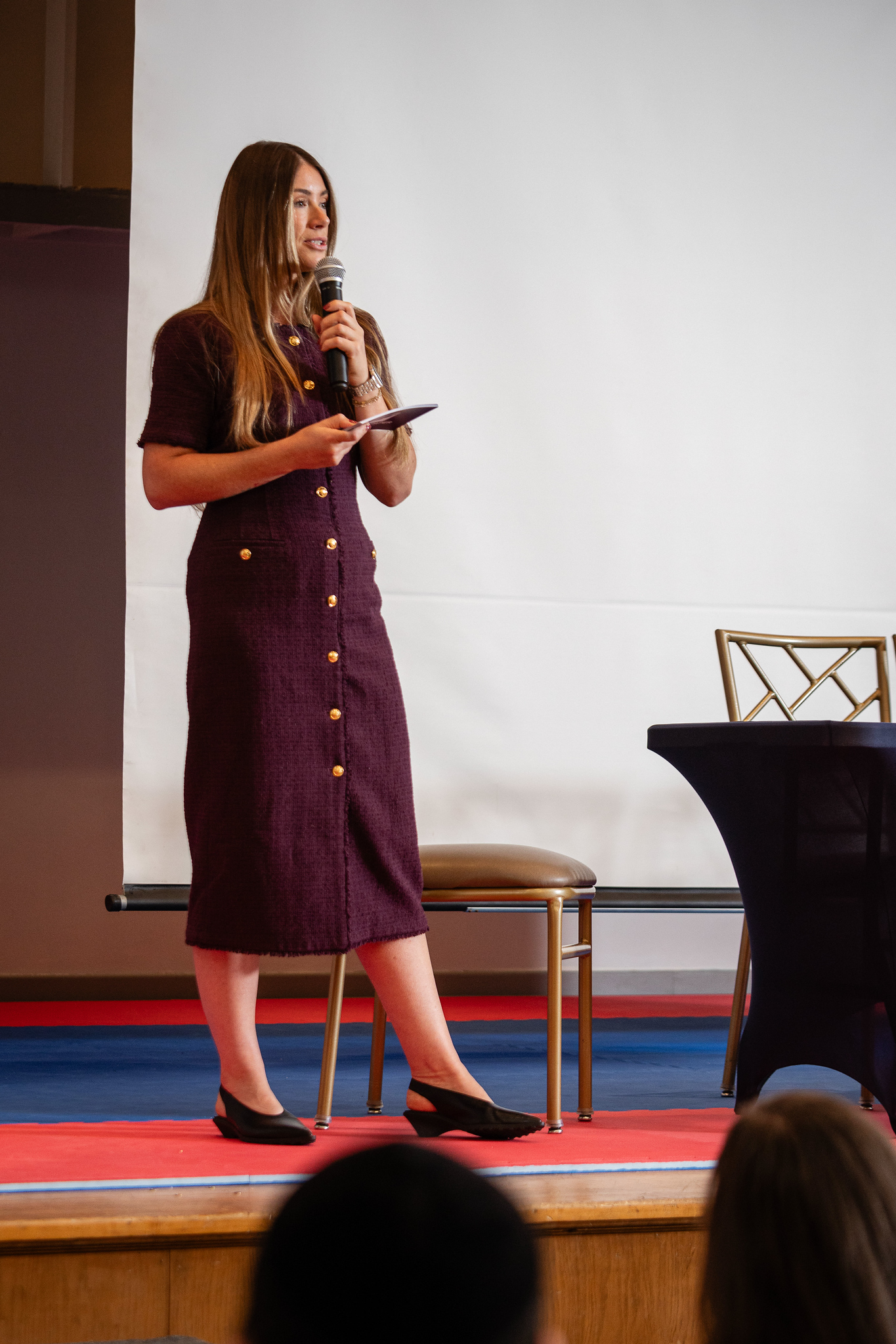Tabitha Rose speaking on stage