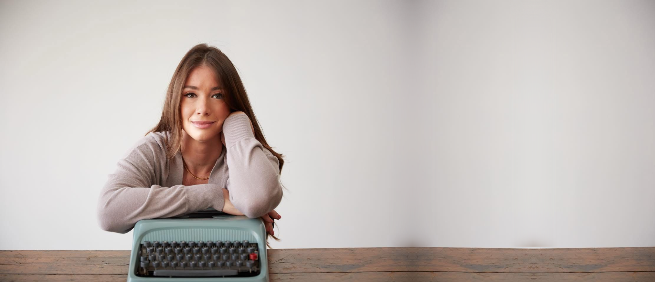 Tabitha Rose, founder of Life to Paper Publishing, at a typewriter